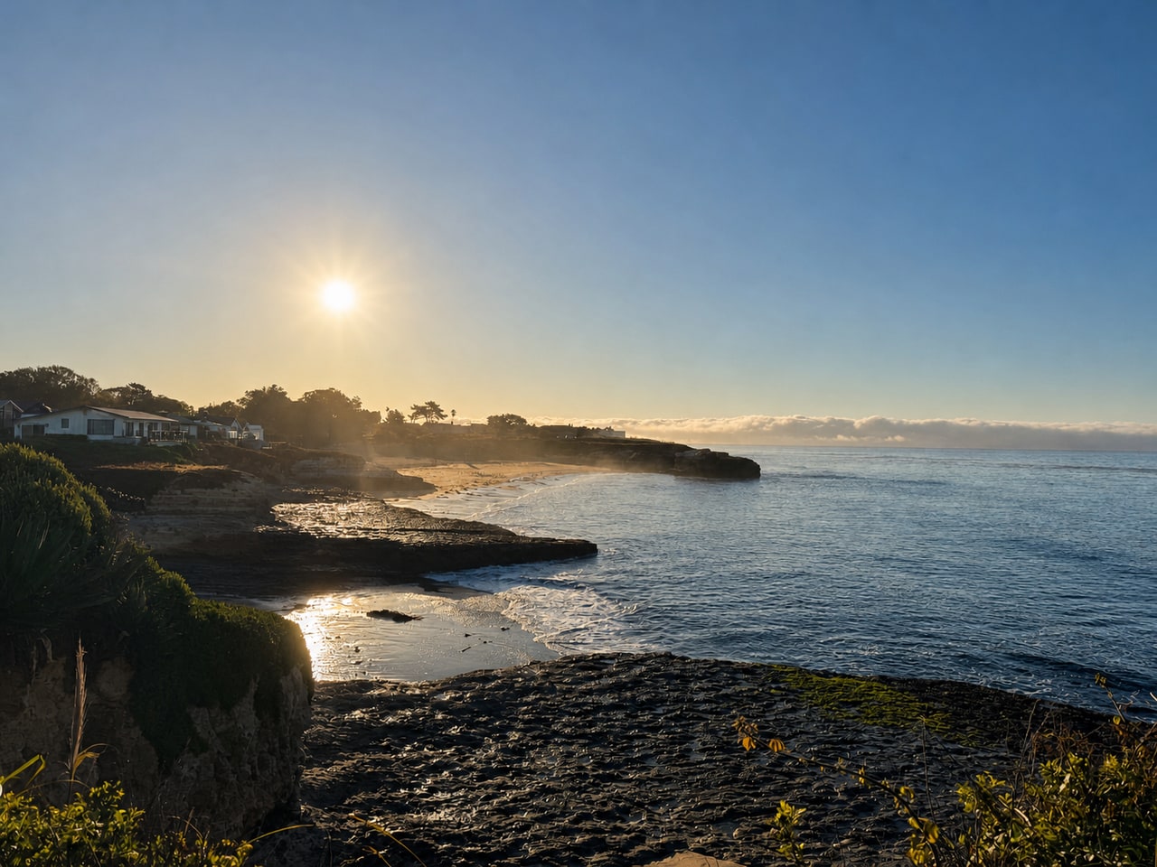 Low coastal sun over the Westside shoreline and Monterey Bay